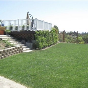 Tokiwa Landscape - Installed grass, trees to hide the ugly decking under the pool, pavers and plants on the slope - Landscaping Near Me - Northridge, California