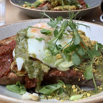 Urbanity - Grilled garlicky halloumi, roast pickled tomato, scallions, avocado aïoli, organic fried egg, hazelnut crunch, sourdough - Cafes Near Me - Dublin, D