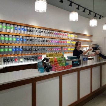 DAVIDsTEA - a woman standing at a counter in a store - Tea Rooms Near Me - Brampton, Ontario