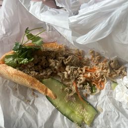 Banh mi Xiu Mai, pork meatballs in a tomato sauce sandwich. I saw no meatballs or no tomato sauce. Banh mi Xiu Mai, pork meatballs in a tomato sauce sandwich. I saw no meatballs or no tomato sauce.