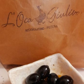 Ostería L'Oca Giuliva - Stale two pieces of bread for 3,80€ came in brown bag (and olives were served) - Italian Near Me - Seville, SE Ostería L'Oca Giuliva - Stale two pieces of bread for 3,80€ came in brown bag (and olives were served) - Italian Near Me - Seville, SE