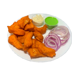 Crispy fish pakoras (15 pcs) paired with zesty tartar sauce and refreshing mint chutney @12.99