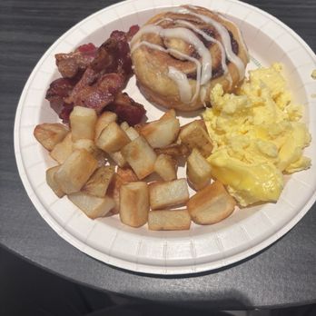 Holiday Inn Express & Suites Chico - Day 1 Breakfast - Bacon, potatoes ( bland) scrambled eggs ( not great), cinnamon roll (delicious) - Hotels Near Me - Chico, California