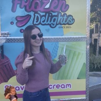 Frozen Delights - a woman holding a cup of ice cream - Ice Cream & Frozen Yogurt Near Me - Spring, Texas Frozen Delights - a woman holding a cup of ice cream - Ice Cream & Frozen Yogurt Near Me - Spring, Texas