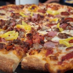 The Ravenite Pizzeria - Meat pizza with added banana peppers