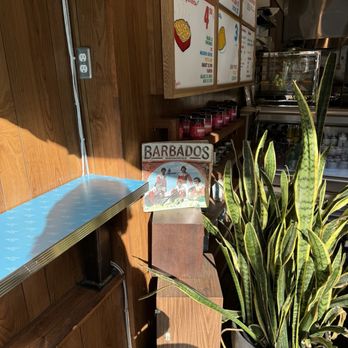 Lloydie's - bar seating by the window - Caribbean Near Me - Montreal, Quebec