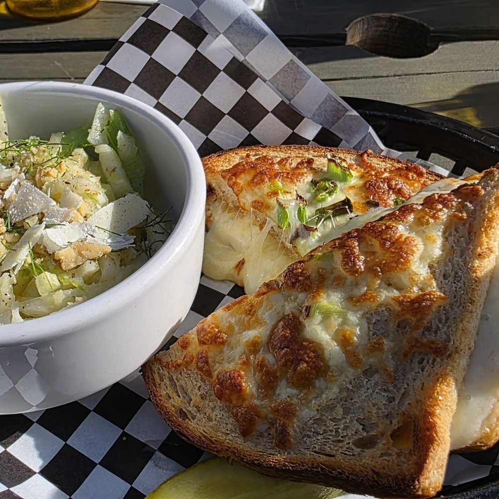 Franks Community Pub - French Onion grilled cheese with fennel salad - Pubs Near Me - Edmonton, Alberta Franks Community Pub - French Onion grilled cheese with fennel salad - Pubs Near Me - Edmonton, Alberta
