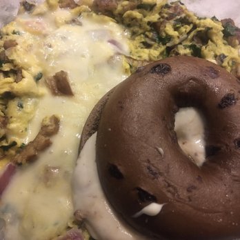 Bagels & Brew - Downtown scramble (sub bacon for sausage and tomatoes for cilantro) and chocolate chip bagel with honey walnut schmear - Bagels Near Me - Lake Forest, California Bagels & Brew - Downtown scramble (sub bacon for sausage and tomatoes for cilantro) and chocolate chip bagel with honey walnut schmear - Bagels Near Me - Lake Forest, California