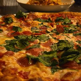Pepperoni and spinach pizza