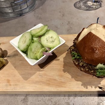Tine & Cellar - Your Adventure quinoa burger with cucumber salad - Modern European Near Me - Weston, Wisconsin Tine & Cellar - Your Adventure quinoa burger with cucumber salad - Modern European Near Me - Weston, Wisconsin