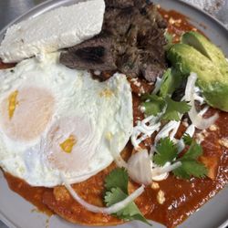 Tu Padre - Spicy, savory, and everything in between - red sauce chilaquiles for the perfect breakfast bite!