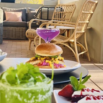 Ebb & Flow - Patio, mahi-mahi sandwich. - Cocktail Bars Near Me - Plano, Texas