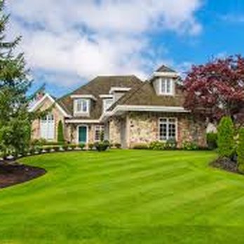 Project Perfection - the front of a home with a large lawn - Lawn Services Near Me Project Perfection - the front of a home with a large lawn - Lawn Services Near Me