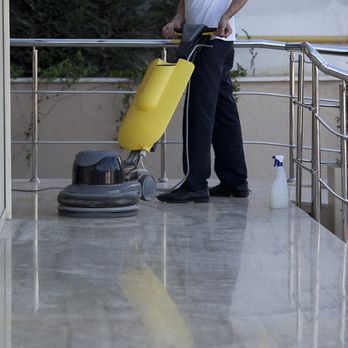 Blooming Facility - a man using a machine on a balcony - Office Cleaning Near Me - Justice, Illinois Blooming Facility - a man using a machine on a balcony - Office Cleaning Near Me - Justice, Illinois