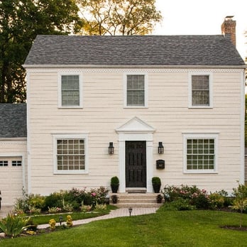 Premier Construction of Illinois - a white house with a black door - General Contractors Near Me - Chicago, Illinois Premier Construction of Illinois - a white house with a black door - General Contractors Near Me - Chicago, Illinois