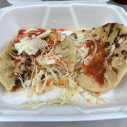 Deli Pupuseria Salvadorena - Chicharrones with cheese pupusas with some shredded slaw and sauce.