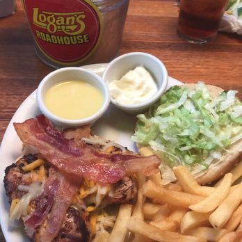 Logan's Roadhouse - Grilled deluxe chicken sandwich ( shredded cheese , bacon and lettuce ) mayo and honey mustard on the side. - Steakhouses Near Me - Myrtle Beach, South Carolina Logan's Roadhouse - Grilled deluxe chicken sandwich ( shredded cheese , bacon and lettuce ) mayo and honey mustard on the side. - Steakhouses Near Me - Myrtle Beach, South Carolina