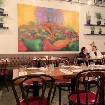 Chela Park Slope - Patio wall art and sitting - Mexican Near Me - Brooklyn, New York