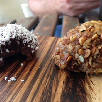 The Source Cafe - A bitten coconut truffle. Gluten-free! - Juice Bars & Smoothies Near Me - Hermosa Beach, California The Source Cafe - A bitten coconut truffle. Gluten-free! - Juice Bars & Smoothies Near Me - Hermosa Beach, California