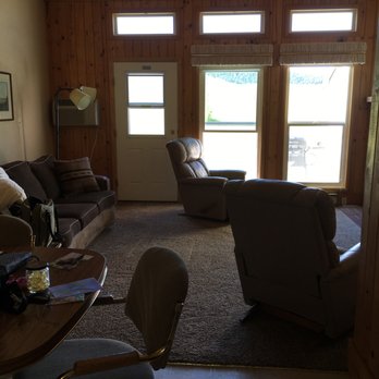 Fairmont Estates Condominium Assn - La-Z Boy chairs (so comfy!), pullout couch, peek of dining table and chairs - Condominiums Near Me - Anaconda, Montana