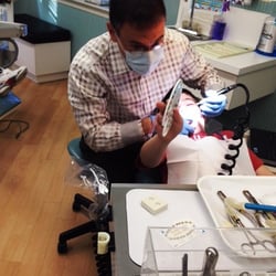 Dr. Jeffrey S. Karlin Orthodontics - Dr Karlin helping pick out the seasonal colors for the ruberbands!