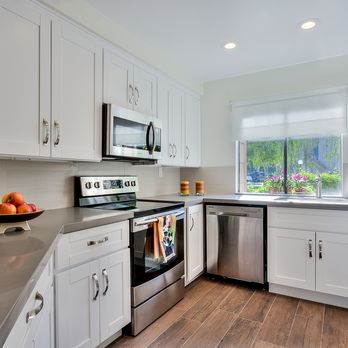 White Oak Construction  - itchen with stainless steel appliances - General Contractors Near Me