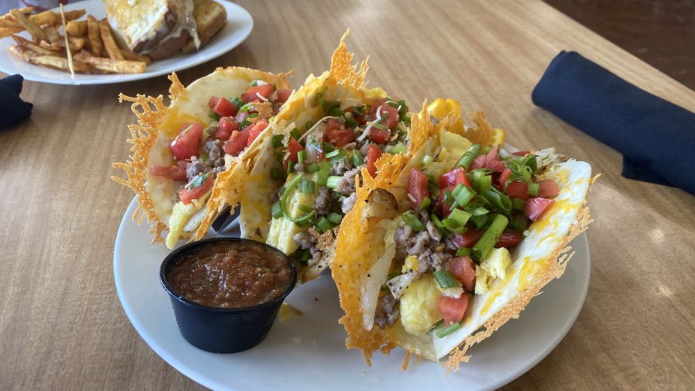 Breakfast Tacos AMAZING! Tortillas griddled w/ cheese + potatoes