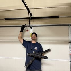 Sun City Garage Doors - Wes, fixing springs.