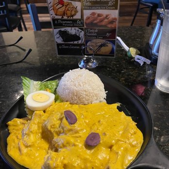 Rustica's Chicken - Aji de Gallina - shredded chicken in a yellow Peruvian sauce with white rice - Peruvian Near Me - Orlando, Florida Rustica's Chicken - Aji de Gallina - shredded chicken in a yellow Peruvian sauce with white rice - Peruvian Near Me - Orlando, Florida