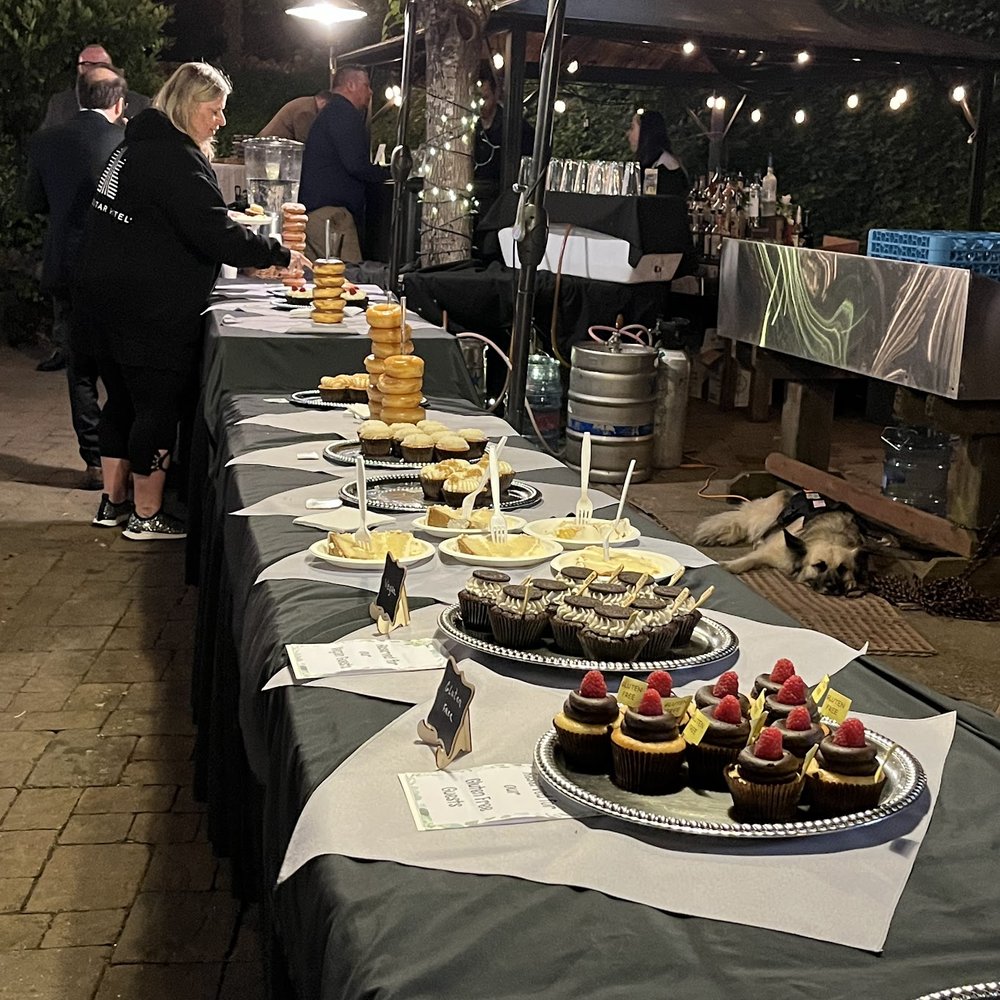 Cupcakin' Bake Shop - The wedding dessert table featuring Cupcakin cupcakes and bridal cake. - Cupcakes Near Me - Oakland, California