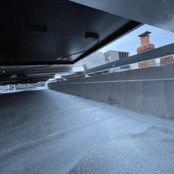 Ralda Roofing & Gutter Handyman - New patches and coating under solar panels