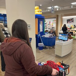 Lady stocking already full shoes instead of helping customers