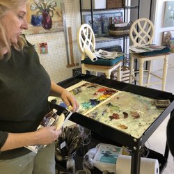 Lorrie Lane Gallery - Lorrie shares tips on oil paint medium with a group.
