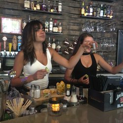 The Office - Friendly servers having a toast with customers.
