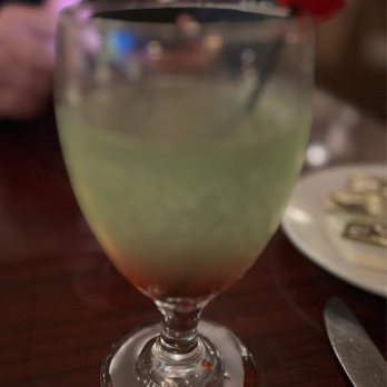 The Grapevine - My seasonal drink - the Grapevine Grinch - with apple picker, Tito's vodka, and a splash of cranberry juice, I believe...very potent! - Italian Near Me - Richmond, Virginia