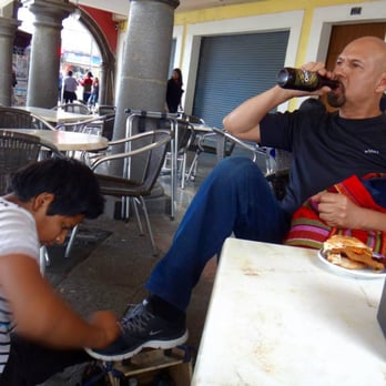 Meche - my friend getting his shoe shined while drinking a beer lol - Cuautlancingo, PUE