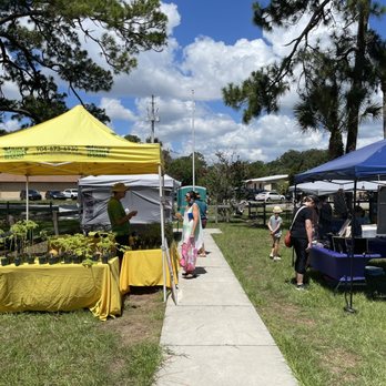 Beaches Green Market - people shopping at tables and tents - Farmers Market Near Me - Jacksonville, Florida Beaches Green Market - people shopping at tables and tents - Farmers Market Near Me - Jacksonville, Florida