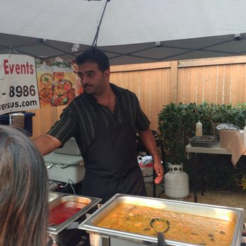 Malabar Catering & Events - a man serving food - Caterers Near Me Malabar Catering & Events - a man serving food - Caterers Near Me