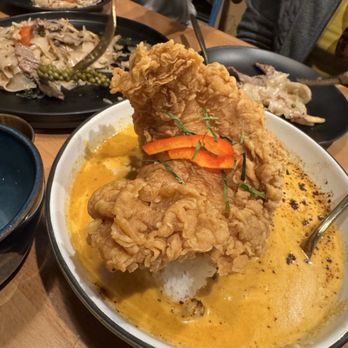 Manaao - Chu Chee Curry with Fried Catfish Filet - "Chu Chee Pla-duk Tod Grob" and "Drunken Noodle" Pad Kee Mao (in the back) - Thai Near Me - Tustin, California Manaao - Chu Chee Curry with Fried Catfish Filet - "Chu Chee Pla-duk Tod Grob" and "Drunken Noodle" Pad Kee Mao (in the back) - Thai Near Me - Tustin, California