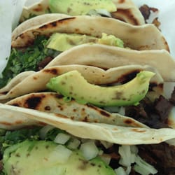 Cantu's Tacos - Lunch combo - four fajita tacos with a side charro beans.