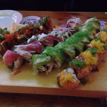 Ohana Belltown - (Left to right) Volcano roll, Ahi tuna roll, Green dragon roll, and Sounders roll - Japanese Near Me - Seattle, Washington Ohana Belltown - (Left to right) Volcano roll, Ahi tuna roll, Green dragon roll, and Sounders roll - Japanese Near Me - Seattle, Washington
