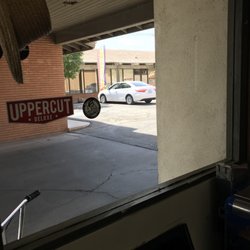 Zavala's Barbershop - Parking lot in small lot between buildings