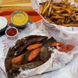 a hot dog and fries on a tray