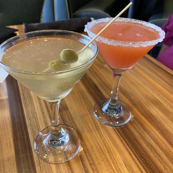 Range Restaurant + Cocktail Bar - Lunch drinks. Dirty martini with grey goose. The pink one is the fairway breeze. Pink grapefruit vodka from belvadier - New American Near Me - Urbandale, Iowa