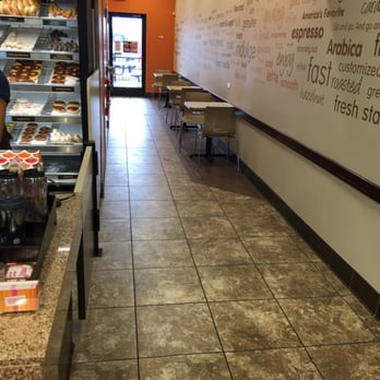 Dunkin' - a man standing in front of a bakery counter - Donuts Near Me - Carrollton, Virginia Dunkin' - a man standing in front of a bakery counter - Donuts Near Me - Carrollton, Virginia