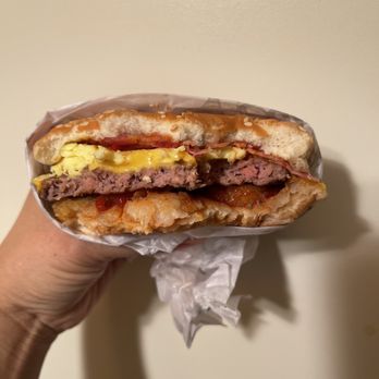 Carl's Jr - a hand holding a sandwich - Burgers Near Me - Hillsboro, Oregon Carl's Jr - a hand holding a sandwich - Burgers Near Me - Hillsboro, Oregon