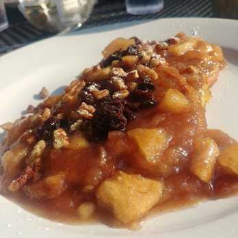 Pomegranate Restaurant - Three pieces of cinnamon spiral bread dipped in French toast batter and smothered with cinnamon apples, plum raisins and pecan sauce. - American Near Me - Aurora, Illinois Pomegranate Restaurant - Three pieces of cinnamon spiral bread dipped in French toast batter and smothered with cinnamon apples, plum raisins and pecan sauce. - American Near Me - Aurora, Illinois