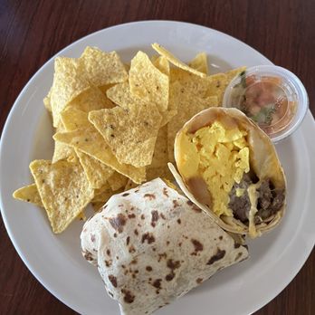 Orange Inn - Breakfast burrito with Steak , Eggs , Potatoes, Cheese . Comes with a side of tortilla chips and small portion of salsa/pico de gallo - Breakfast & Brunch Near Me - Laguna Beach, California Orange Inn - Breakfast burrito with Steak , Eggs , Potatoes, Cheese . Comes with a side of tortilla chips and small portion of salsa/pico de gallo - Breakfast & Brunch Near Me - Laguna Beach, California