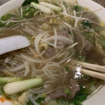 Pho 75 - Rare steak, meatballs and fatty briskets with a side of vinegar onion and fatty broth. - Vietnamese Near Me - Arlington, Virginia Pho 75 - Rare steak, meatballs and fatty briskets with a side of vinegar onion and fatty broth. - Vietnamese Near Me - Arlington, Virginia