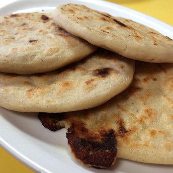 El Caracol Café - Pupusas (usually 3 but we ordered an extra). We always put a ton of the pickled cabbage and tomato sauce on top. It's delicious! - Mexican Near Me - Vancouver, British Columbia El Caracol Café - Pupusas (usually 3 but we ordered an extra). We always put a ton of the pickled cabbage and tomato sauce on top. It's delicious! - Mexican Near Me - Vancouver, British Columbia